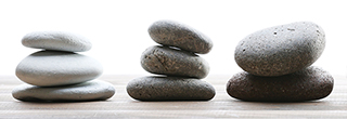 Image of stones used in Hot Stone Therapy. Use of the stones enhances the effectiveness clinical massage in certain circumstances